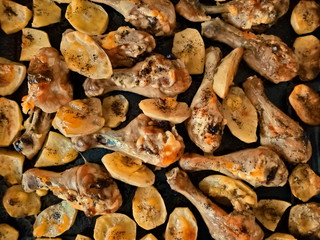 Baked chicken legs and potatoes