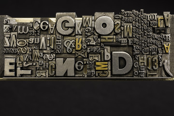 Metal Letterpress Types.
A background from many historical typography letters in black and white with white background.
