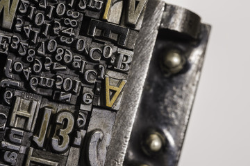 Metal Letterpress Types.
A background from many historical typography letters in black and white with white background.
