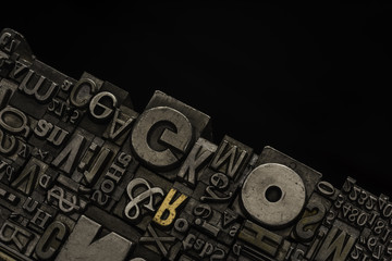 Metal Letterpress Types.
A background from many historical typography letters in black and white with white background.
