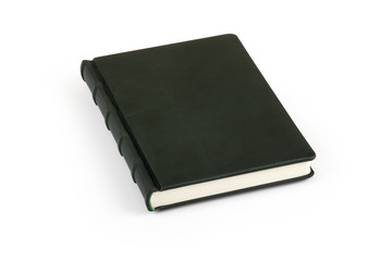 Dark green book with classical leather binding without title on the white background, isolated with clipping path