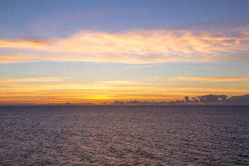 Sunrise on a Caribbean Cruise-  Beautiful orange and pink sunrise over the Ocean 
