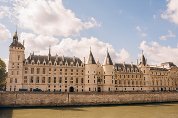 Fototapeta na wymiar a daytime view of the castle Conciergerie - former Royal Palace and prison. located in the West of the island of the city and today it is part of a large complex known as the Palace of justice. Paris