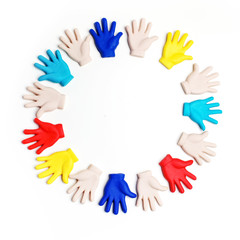 Autism awareness concept with colorful hands on white background. Top view
