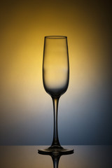 A glass on a blue yellow background