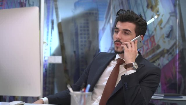 Businessman answering the mobile phone