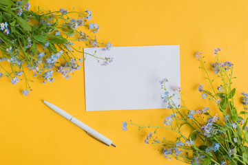 Mockup white greeting card with blue flowers
