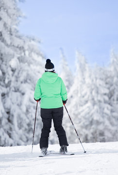 Woman skiing and enjoying winter on mountains