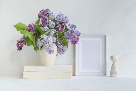 Mockup with a white frame and lilac branches
