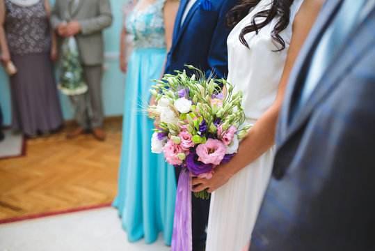 Bride with Flowers at Ceremony