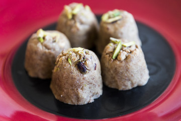Adadiya (sweetened black gram flour fudges made with cardamom, ginger, nutmeg,almonds and saffron ) – Indian Sweet made in the winters