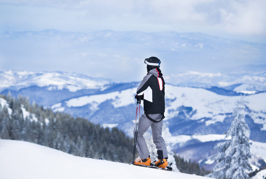Man skiing and enjoying winter on mountains