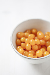 small cocktail tomatoes on a white background