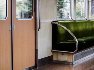 green seat inside the train