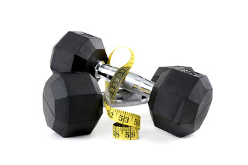 Pair of dumbbell weights and tape measure isolated white background