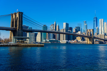 Lower Manhattan Downtown skyline panorama from Brooklyn Bridge Park riverbank, New York City, USA