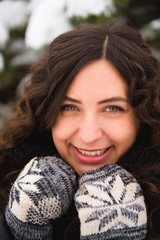 Happy young woman walking in winter time