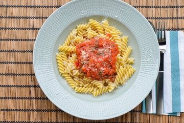 Fusilli pasta with tomatosauce, basil and parmesan