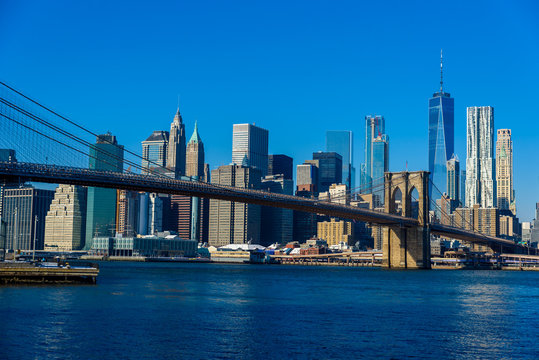 Lower Manhattan Downtown skyline panorama from Brooklyn Bridge Park riverbank, New York City, USA