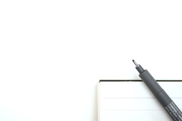 notebook and pen on White background