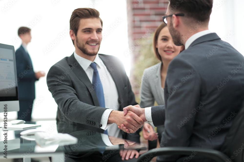 Wall mural happy man introducing businesswoman to business partners