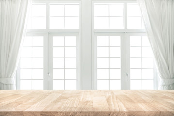 Fototapeta na wymiar Wood table top on blur of white window with curtain background