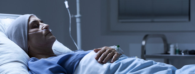 Dead senior woman with headscarf