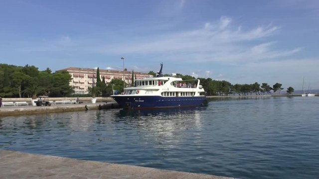 boat enters the harbor of brijuni croatie
