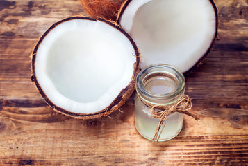 coconut and coconut milk on wooden table