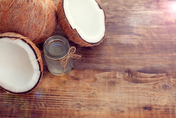 coconut and coconut milk on wooden table