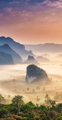 Fototapeta na wymiar Phu Langka national park, The landscape of misty mountains and sunrise, Phayao province in Thailand..