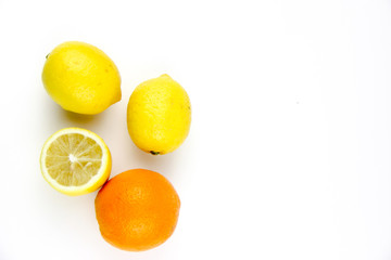 fresh fruits. Lemons and oranges sliced and whole