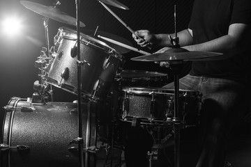 The man is playing drum set.