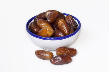 dates in the oriental style bowl. bowl with oriental pattern. flat lay food.oriental sweets. date fruit. dried fruit