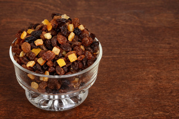 closeup raisins currants and sultanas with candied peel in a glass bowl