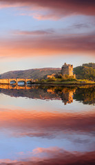 The Eilean Donan Castle with colorful sunset, Highlands of Scotland