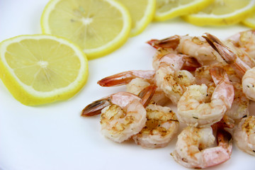 seafood. shrimp on a plate with lemon.