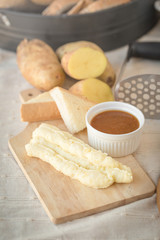 Mashed potatoes in a plate on a wooden table