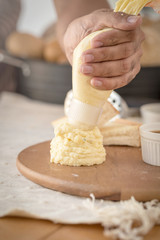 Mashed potatoes in a plate on a wooden table