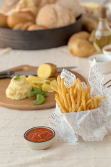 French fries with ketchup on wooden background