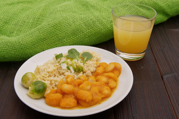 Pumpkin sauce and beans with bulgur on a table
