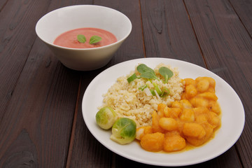 Pumpkin sauce and beans with bulgur on a table