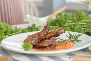 Rack of Lamb with Grilled Peach on white dish