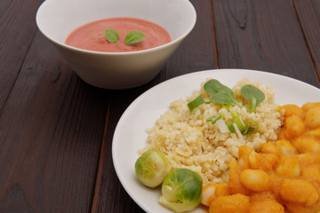 Pumpkin sauce and beans with bulgur on a table