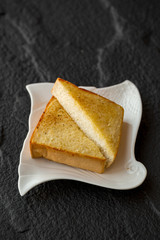 Plate with tasty toasts with honey and cheese