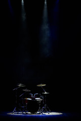 drums on stage in the spotlight