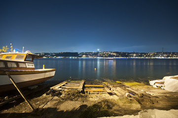 Fishing boat from Cengelkoy with night view of Istanbul