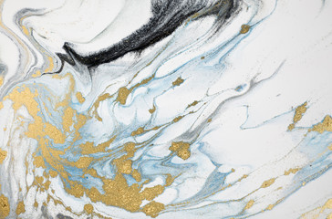Marble abstract acrylic background. Nature marbling artwork texture. Golden glitter.