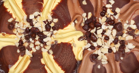 Chocolate and vanilla ice cream with sprinkles background and texture 