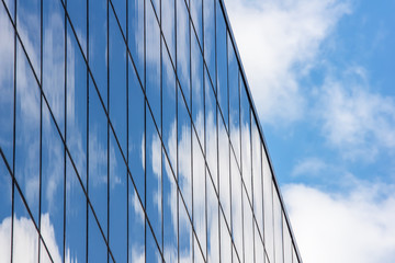 Fototapeta na wymiar Reflection of the sky on the glass of a building